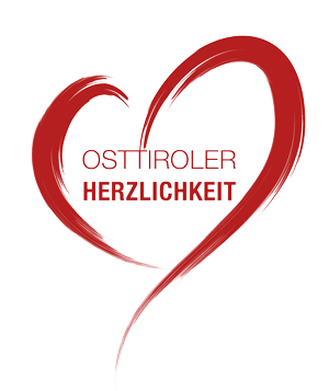 Logo Osttiroler Herzlichkeit Das Logo für Osttiroler Herzlichkeit umrandet von einem roten Herz.